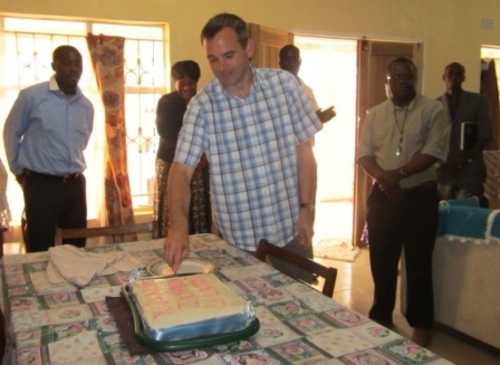Cutting a cake to celebrate the opening of the new Home