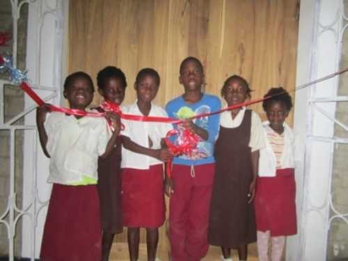 At the entrance of their new home...